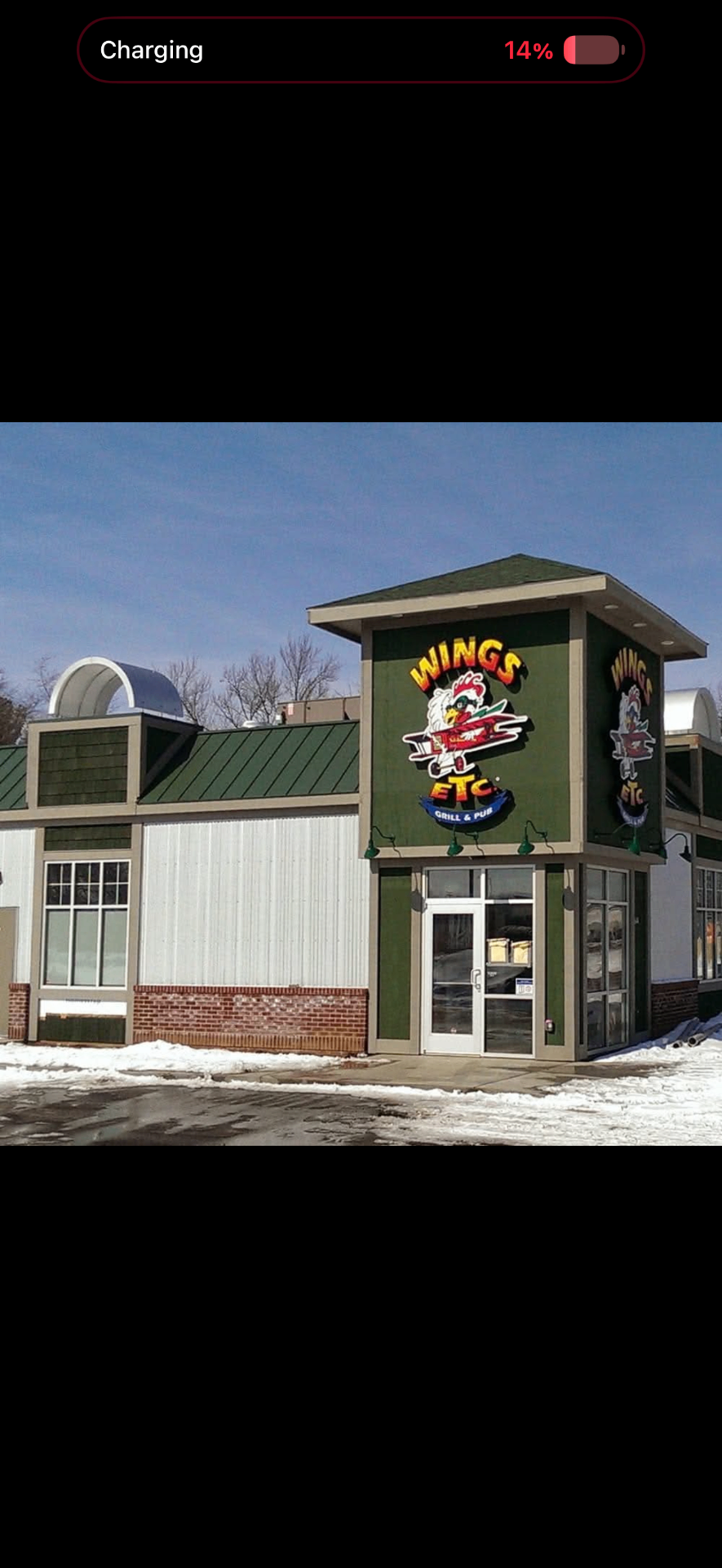 Wings Etc. Grill & Pub building exterior with signage on Co Rd 6 in Elkhart